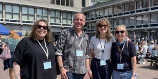 The photo shows Ann Kristin Augst, Cornelius Schubert, Ronja Trischler and Julia Kurz standing in front of the building at the EASST-4S in Amsterdam.