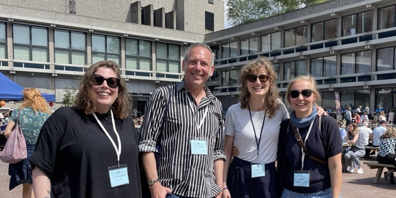 The photo shows Ann Kristin Augst, Cornelius Schubert, Ronja Trischler and Julia Kurz standing in front of the building at the EASST-4S in Amsterdam.